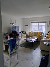 a living room with furniture and a tv