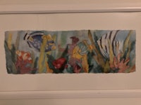 a watercolor painting of tropical fish in a frame