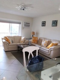 a living room with couches and a table